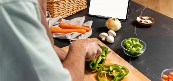 Man analyzing grocery receipt
